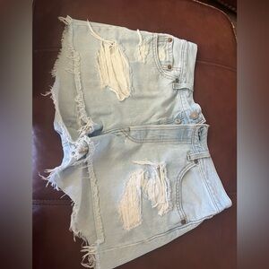 Levi’s 501 Distressed Light Blue Denim Shorts